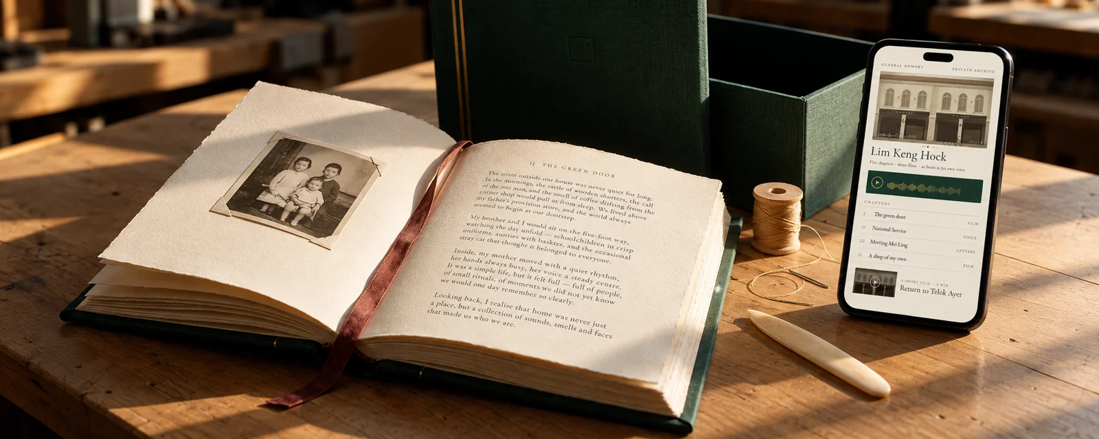 A handbound memoir with family photographs, beside a phone displaying a private archive of stories, voice recordings and films.
